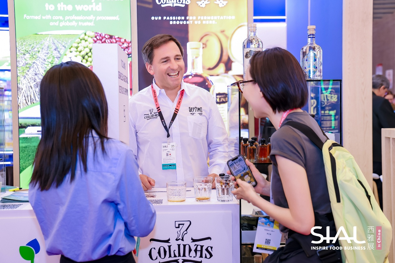 <img src="trade-show-hall.jpg" alt="SIAL Shanghai exhibition hall with crowded booths and professional business environment">