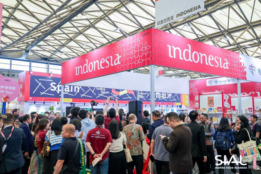 2026 SIAL food trade fair exhibition scene with attendees at an exhibition booth