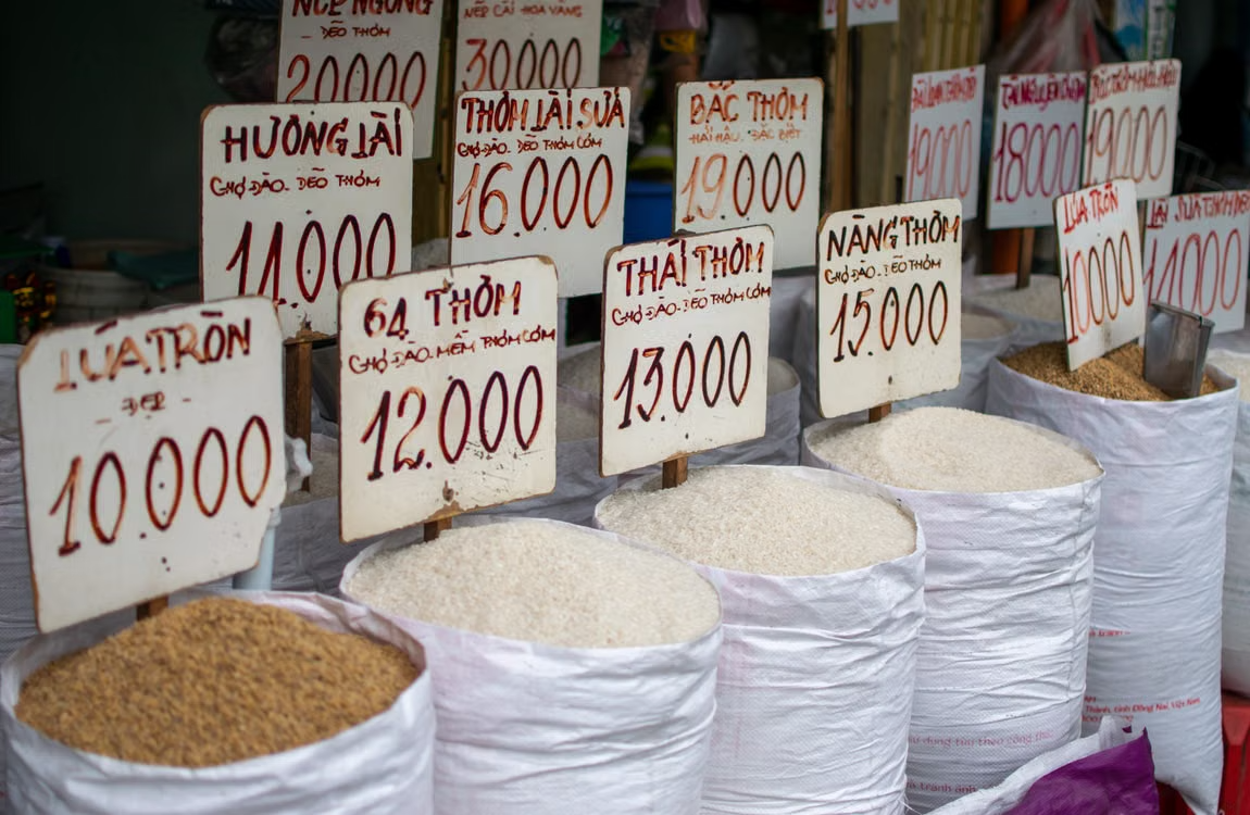 A display of various rice types for sale at a market stall