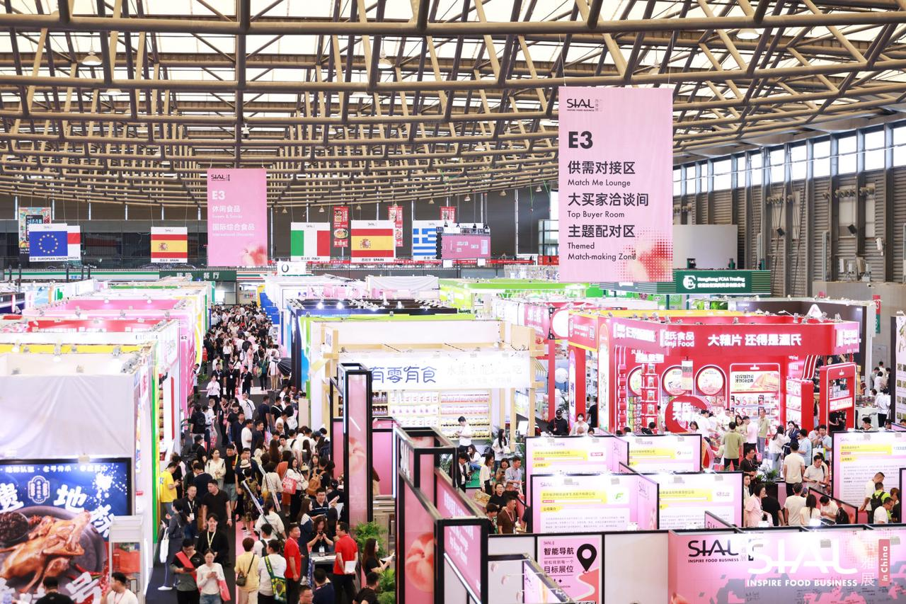 Overview of exhibition hall with booths and crowd at SIAL in China